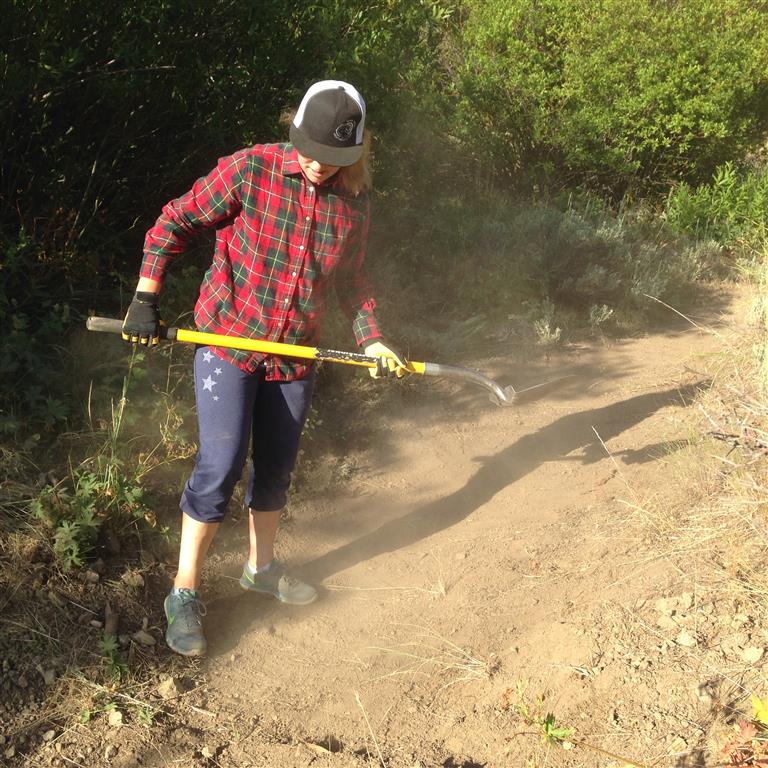 Savana doing trail maintenance on Oregon Gulch Trail.